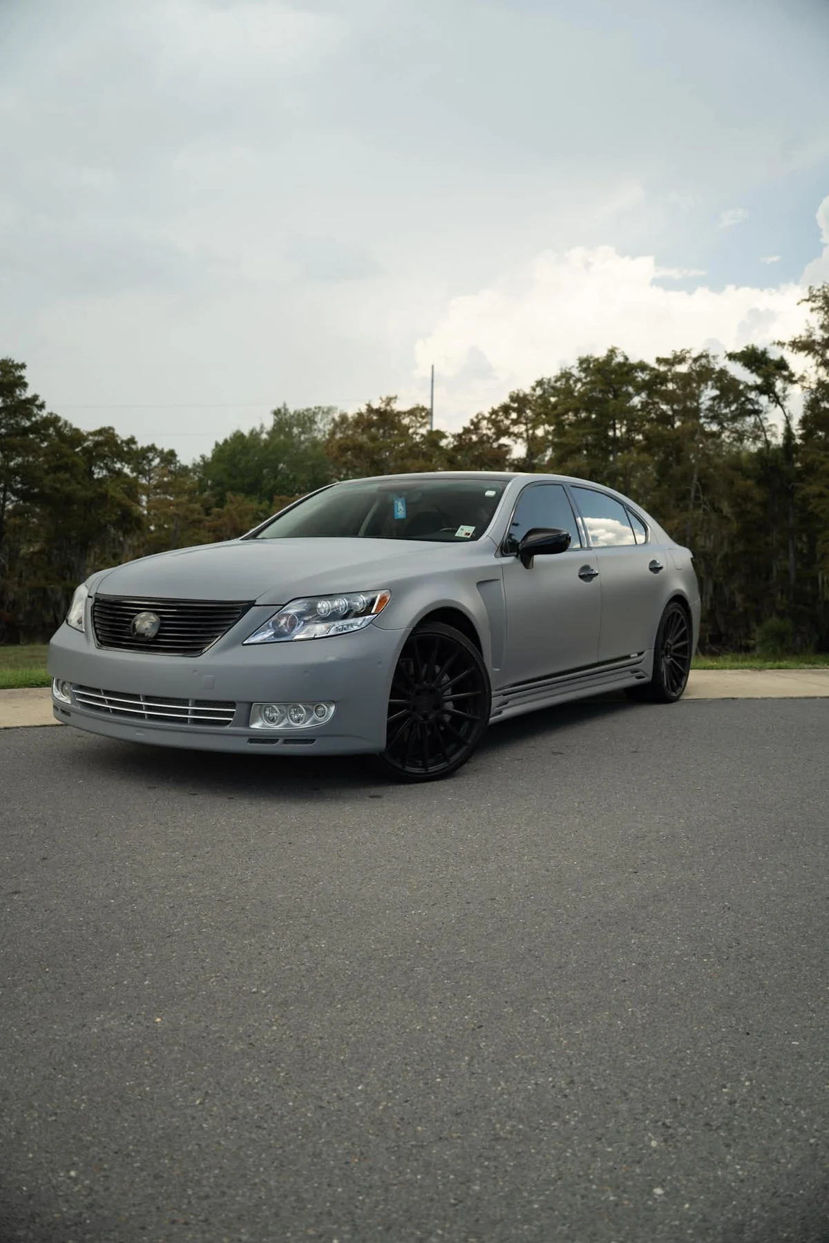 Lexus LS finished in flat Nardo grey vinyl with gloss black accents
