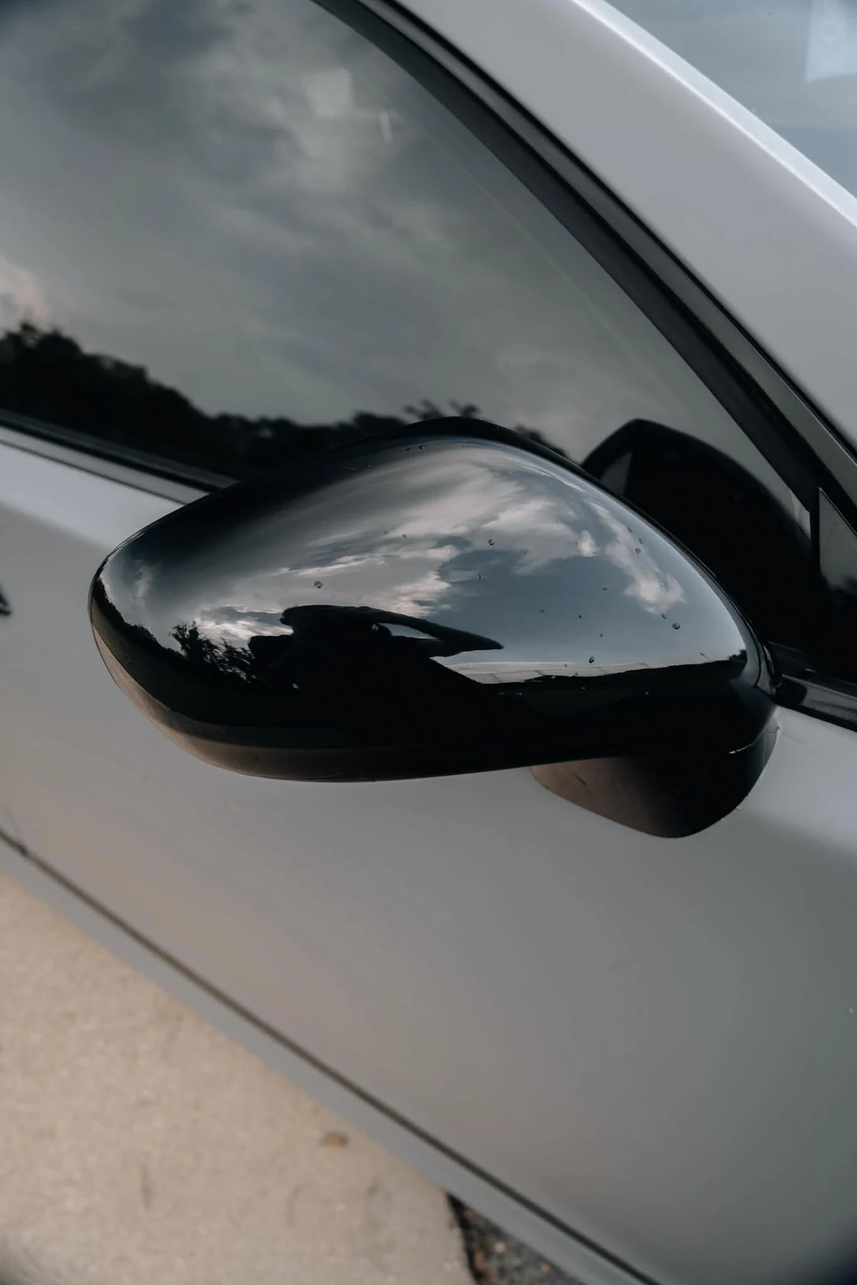 Gloss black mirror accent on flat Nardo grey wrapped Lexus LS